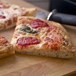 Het essentiële verschil tussen ronde en vierkante pizza's